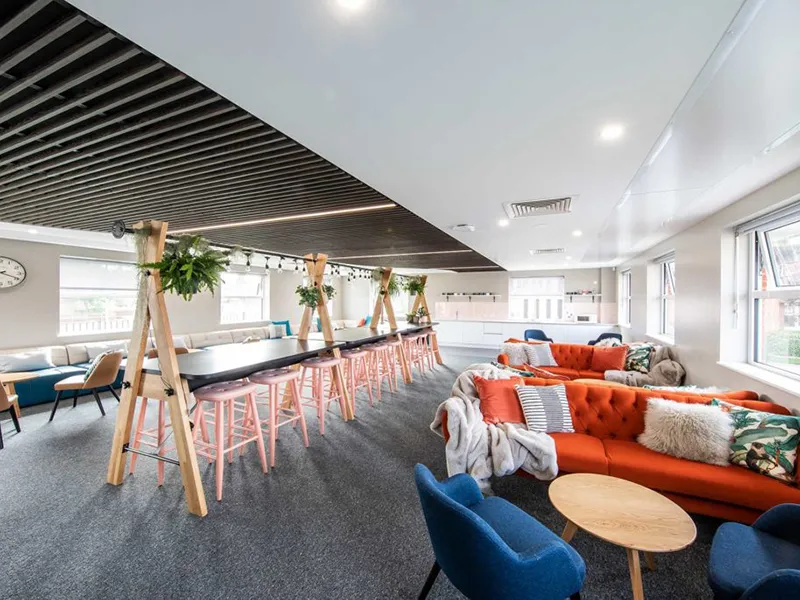 An inside view of a modern college sitting area